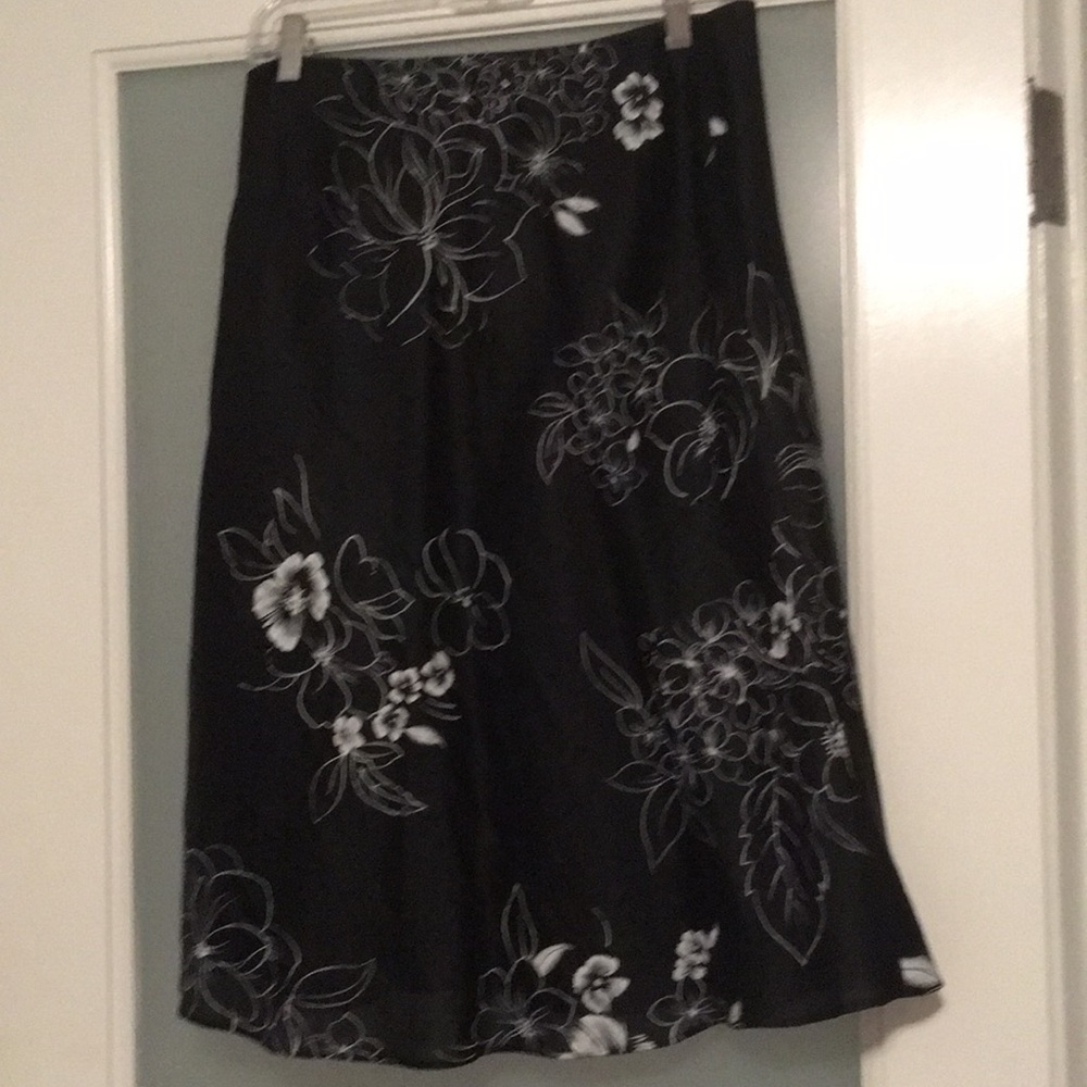 Black skirt with white flowers.